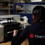 From Paper to Digital to Recycled - Closing the Loop in Document Disposal A person using a printer AI-generated content may be incorrect.